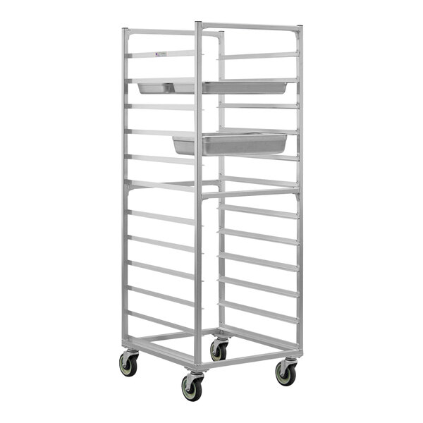 A white metal side load steam table pan rack with trays on wheels.