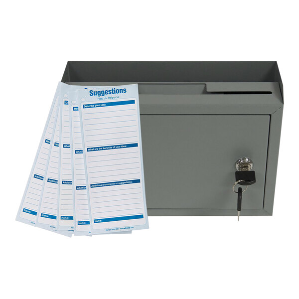 A gray steel ADIRoffice wall mounted suggestion box with a key and suggestion cards.