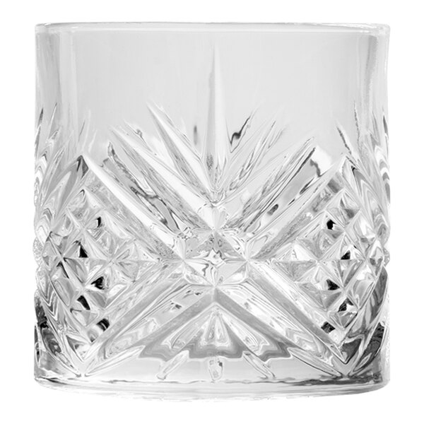 A close up of an Arcoroc clear glass with a diamond pattern.