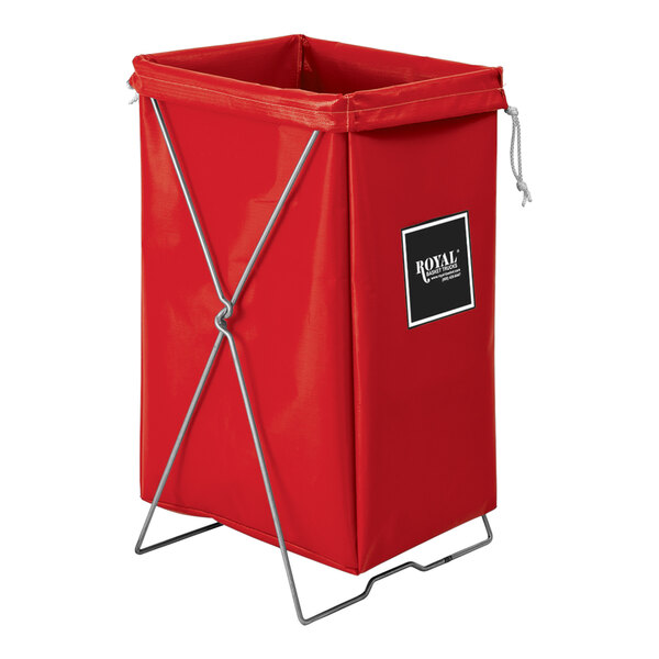 A red Royal Basket Trucks laundry basket with black handles and a metal stand.