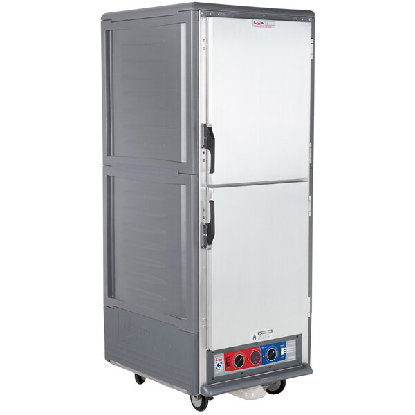 A large gray Metro C5 heated holding and proofing cabinet with wheels.