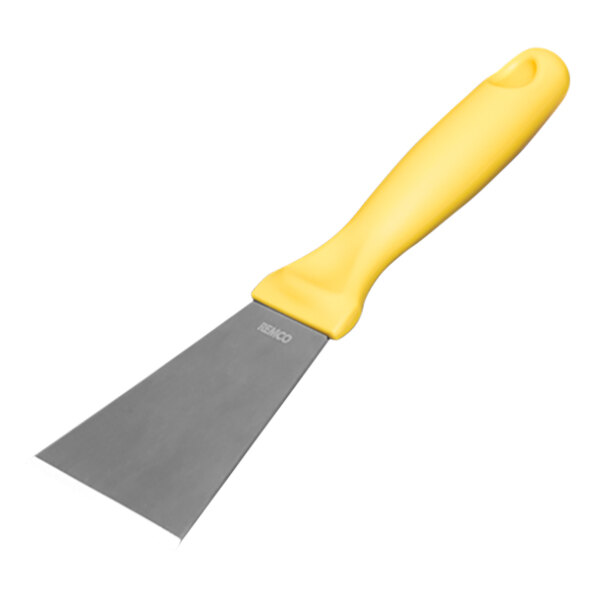 A Remco stainless steel spatula with a yellow handle.