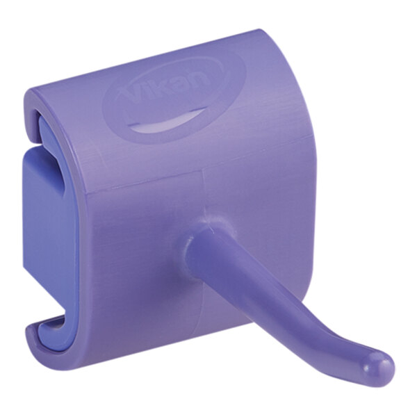 A purple plastic Vikan wall bracket hook.