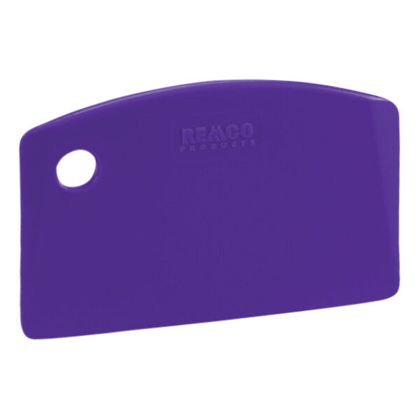 A purple plastic Remco bench scraper with a white circle and a hole in the handle.
