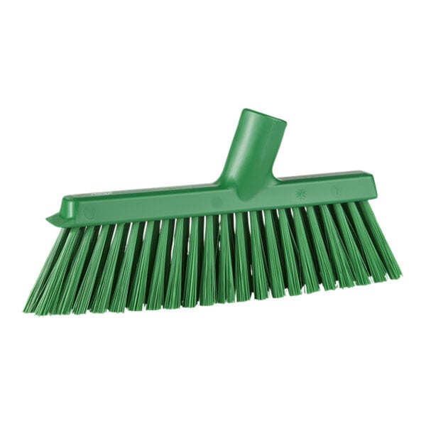 A green angled broom head with medium bristles.
