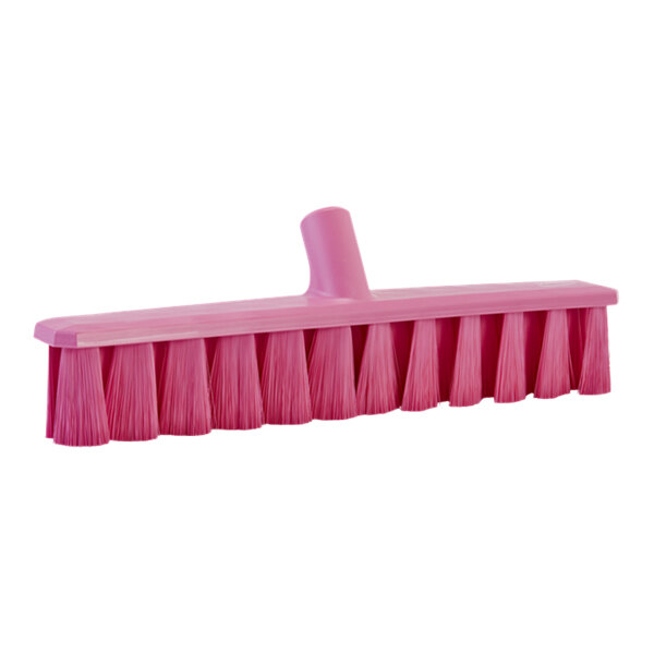 A pink Vikan broom head with long soft bristles.