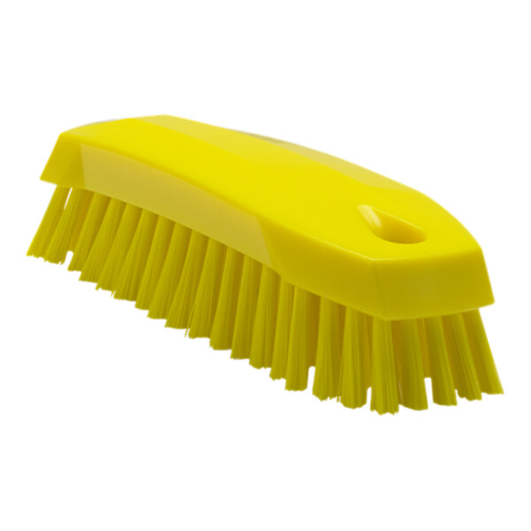 A Vikan yellow scrub brush with medium bristles.