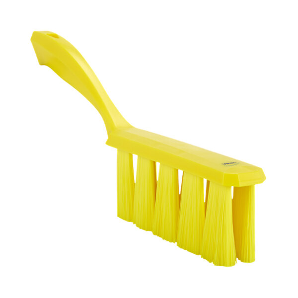 A close-up of a yellow Vikan bench brush with long soft bristles.