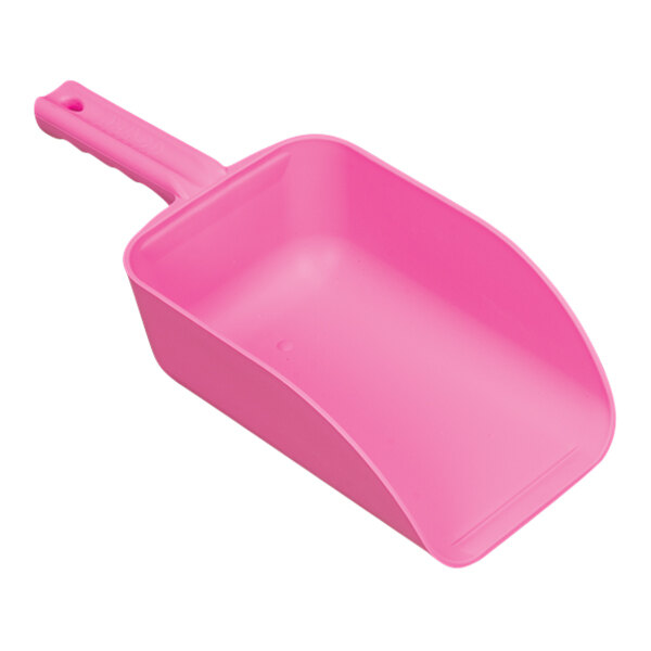 A pink plastic scoop with a hole in the handle.
