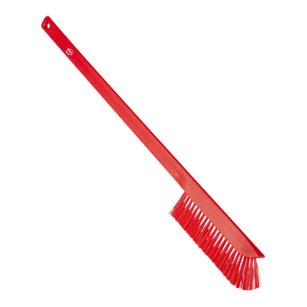 A red Vikan Ultra-Slim cleaning brush with white bristles.