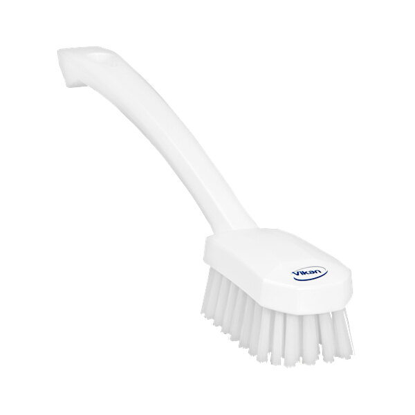 A white Vikan utility brush with a handle.