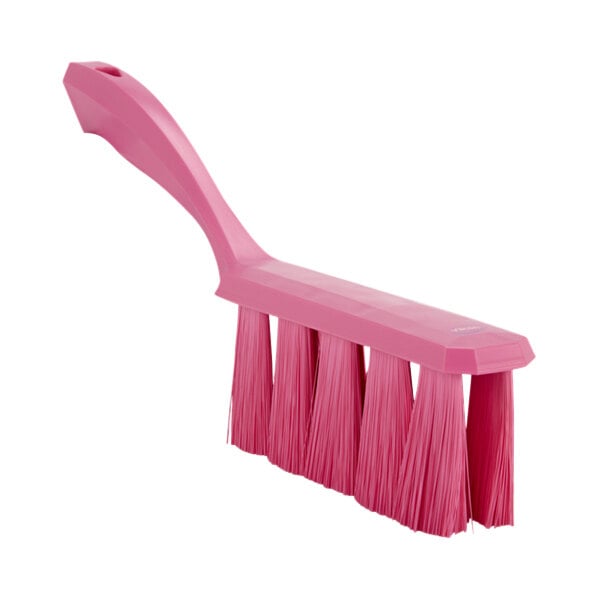 A Vikan pink bench brush with long bristles.