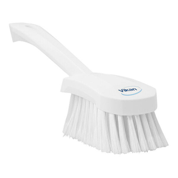 A close-up of a Vikan white washing brush with a short handle.