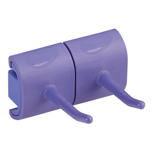 A purple plastic Vikan double hook wall bracket.