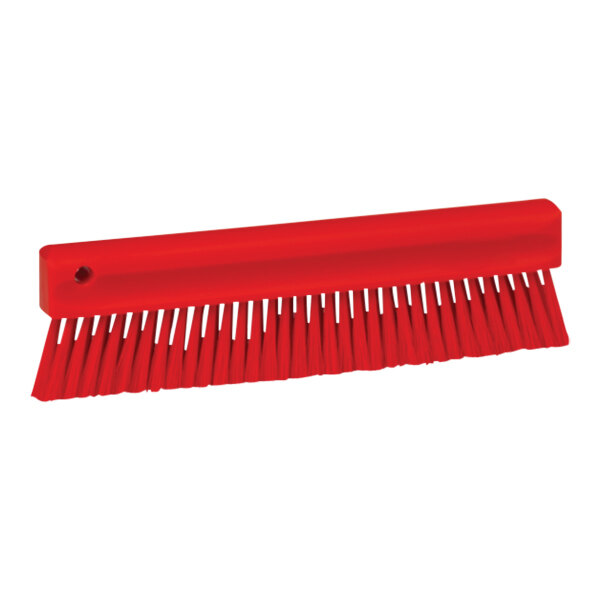 A Vikan red brush with long bristles and a handle.