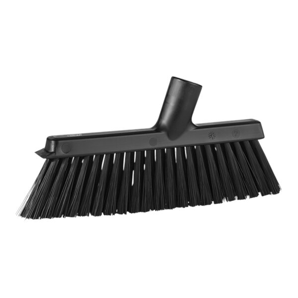 A black broom head with long bristles.