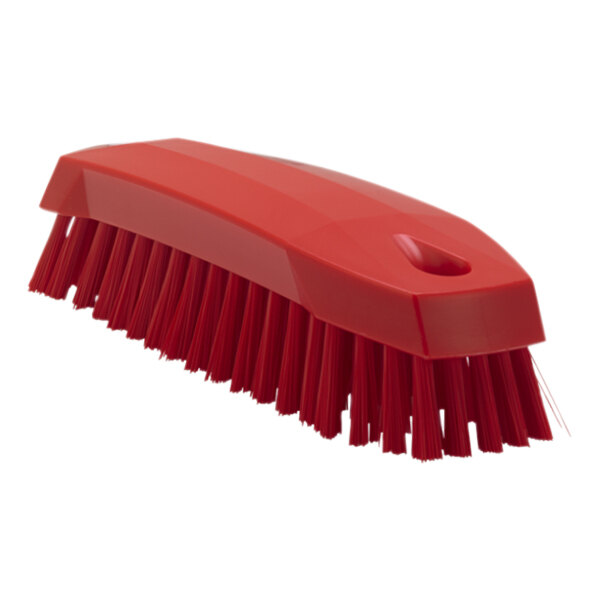 A red Vikan scrub brush with a handle and bristles.