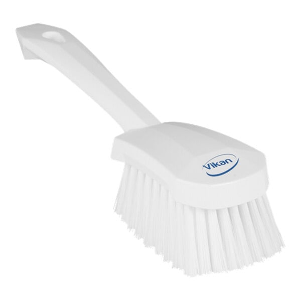 A white Vikan washing brush with a blue handle.