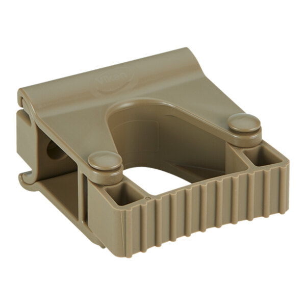 A brown plastic Vikan wall bracket with holes.