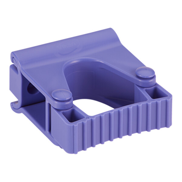 A purple plastic Vikan wall bracket with holes.