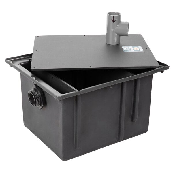 A black Zurn polyethylene grease trap with pipe connections.