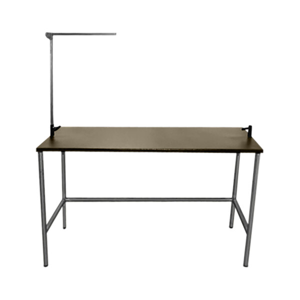A tan stainless steel Groomer's Best pet grooming table with a metal frame.