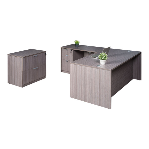 A Boss Holland desk with return and storage pedestal attached to a lateral storage cabinet with drawers.