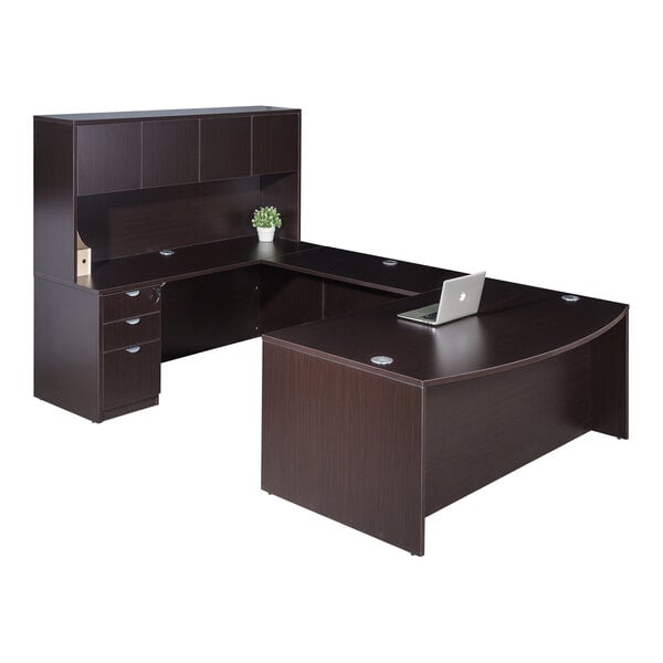 A Boss mocha laminate desk with a laptop on it above two drawers and a cabinet.