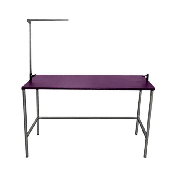 A purple Groomer's Best grooming table with metal legs.