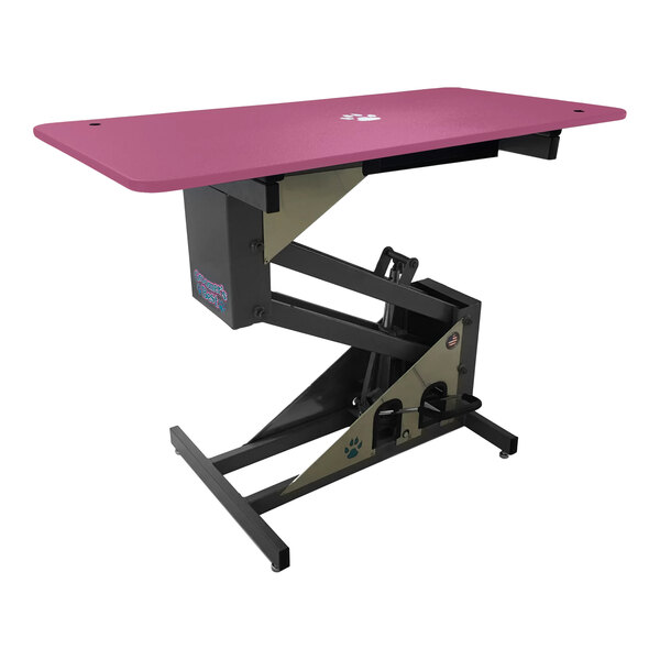 A pink table with a black base and a black top.