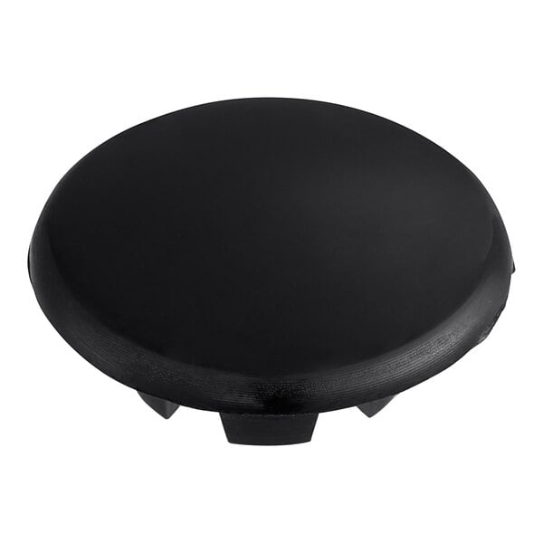 A black plastic circular plug.