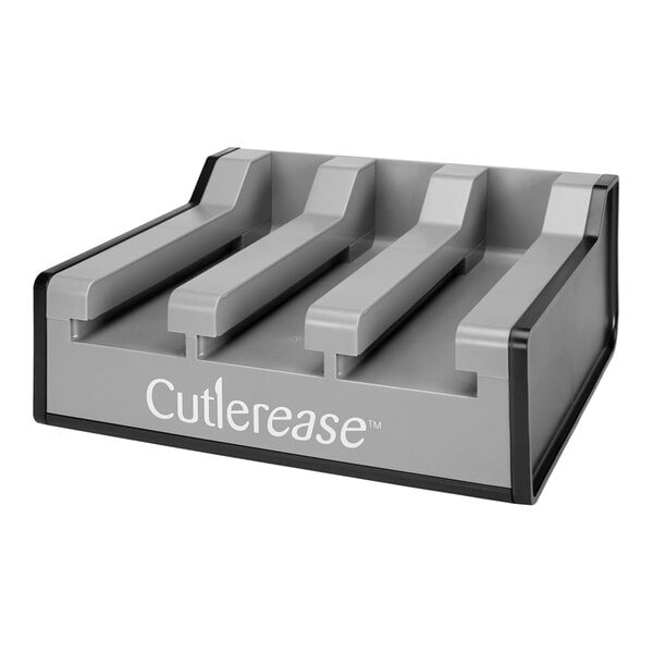 A grey Cutlerease triple dispenser base with four slots.