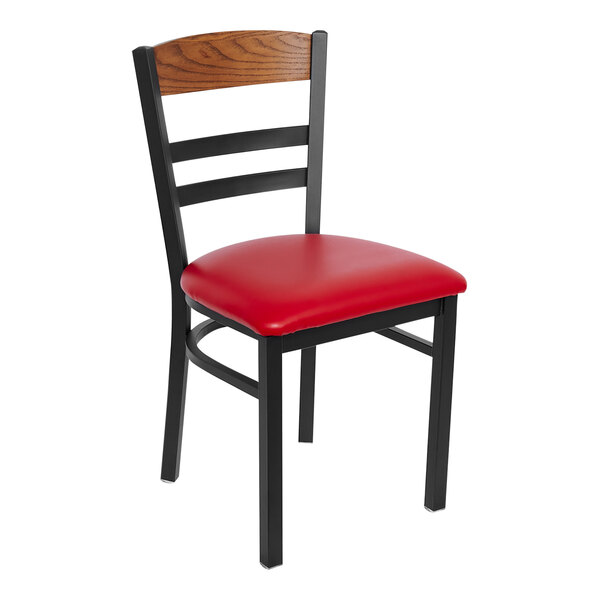A black steel BFM Seating side chair with a red vinyl seat.