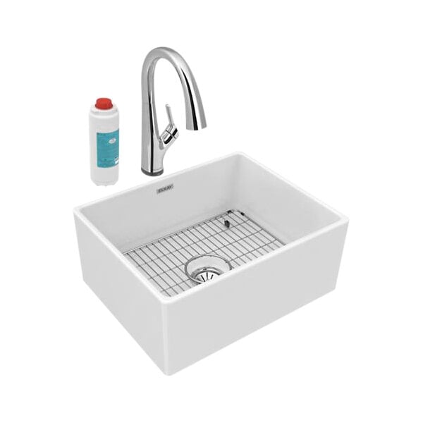 A white Elkay single bowl farmhouse sink with faucet and metal grate.
