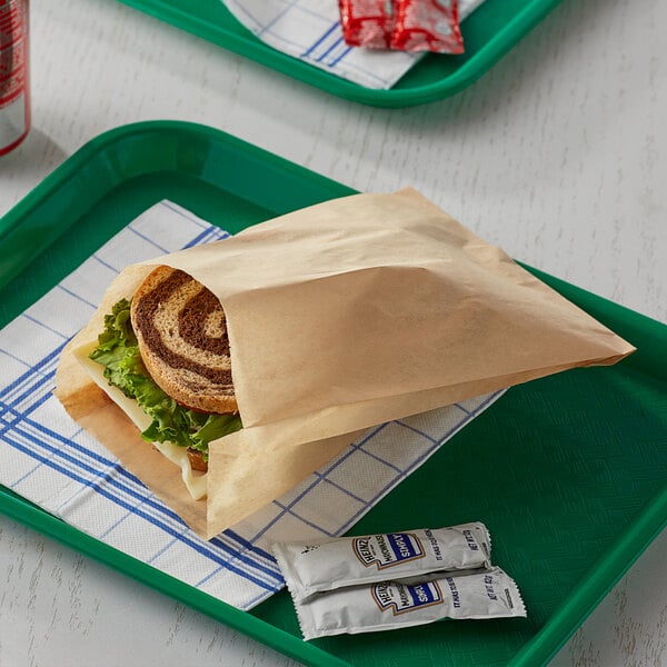 A sandwich in a Bagcraft EcoCraft sandwich bag on a tray.