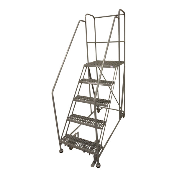 A gray powder-coated steel Cotterman rolling work platform with handrails and metal bars.