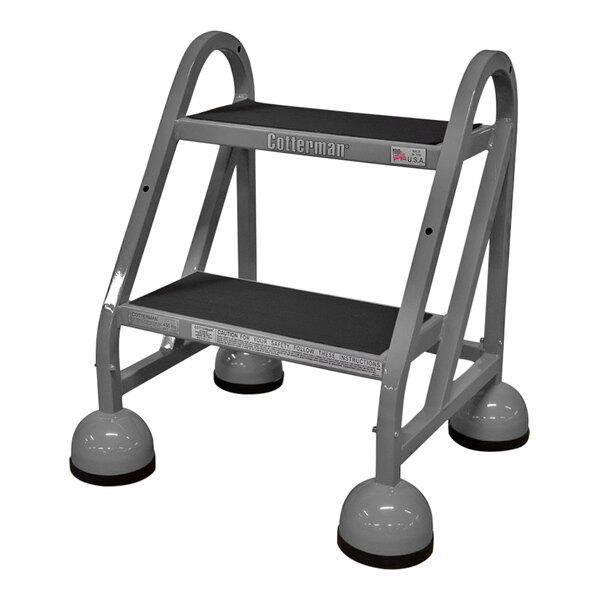 A gray Cotterman MasterStep rolling office ladder with black wheels.