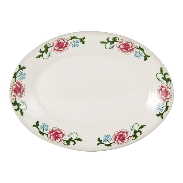 A white Tuxton oval china platter with pink flowers on it.