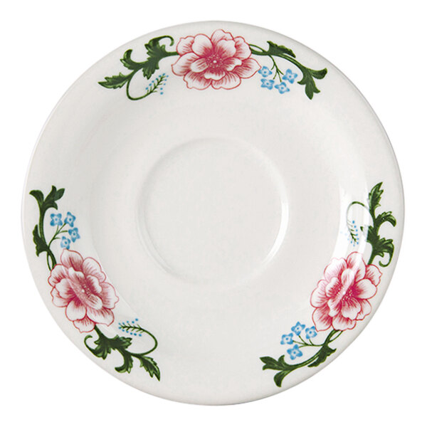 A white Tuxton saucer with a circular edge and pink flowers.