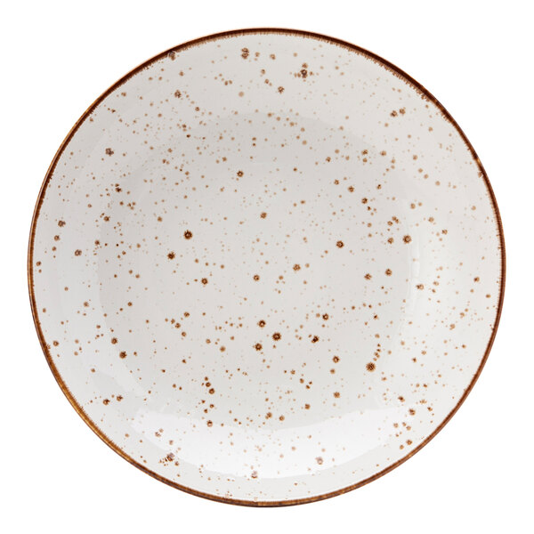 A white Tuxton pasta bowl with brown speckled spots.