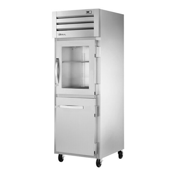 A white True reach-in refrigerator with glass doors.