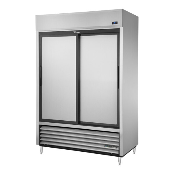 A silver True 2 section sliding door reach-in refrigerator with black doors.