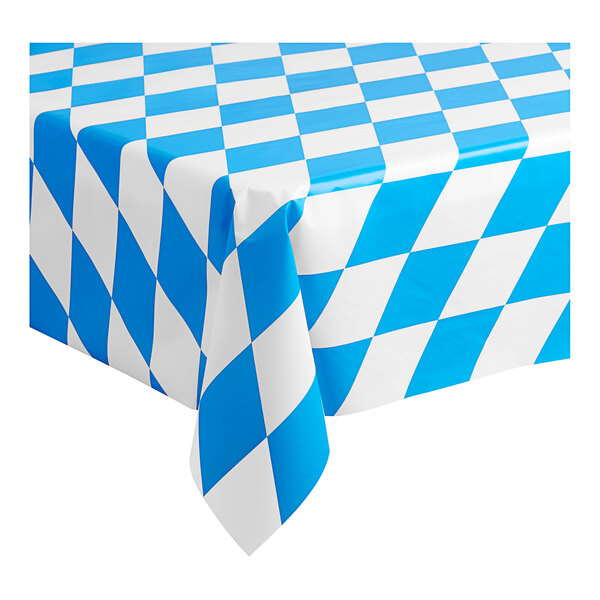 A blue and white checkered Table Mate plastic table cover with a diamond pattern on a table.