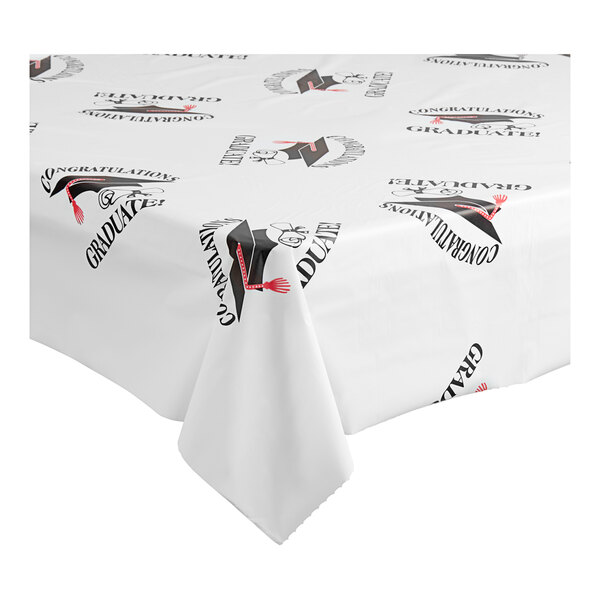 A white Table Mate tablecloth with black and red graduation designs.