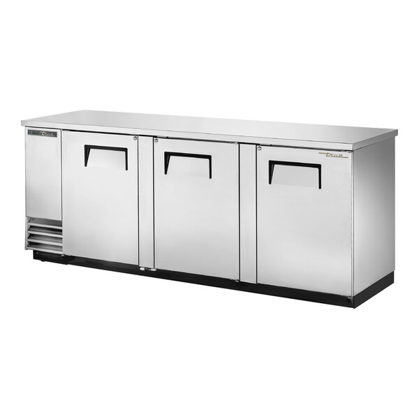 A stainless steel True back bar refrigerator with solid doors.