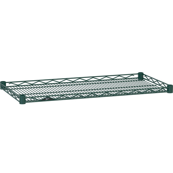 A Metro Hunter Green wire shelf with a wire rack on it.