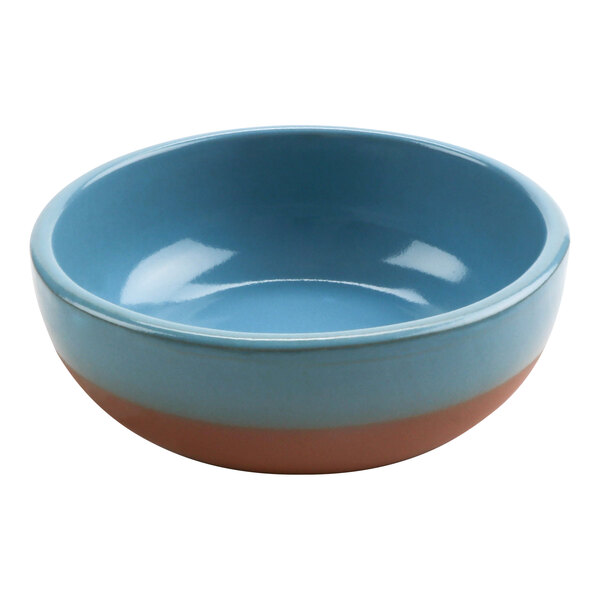 A blue bowl with brown rim.