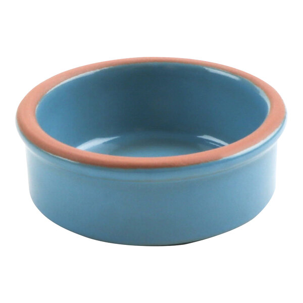 A blue terracotta casserole dish with a pink rim.