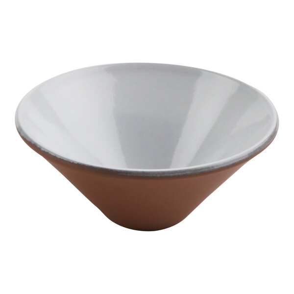 A white terracotta bowl with a white rim and brown accents.