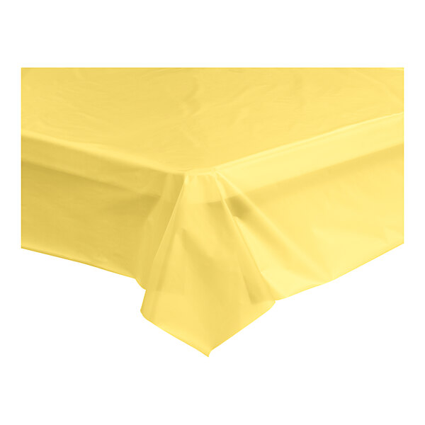 A yellow plastic table cover on a yellow surface.